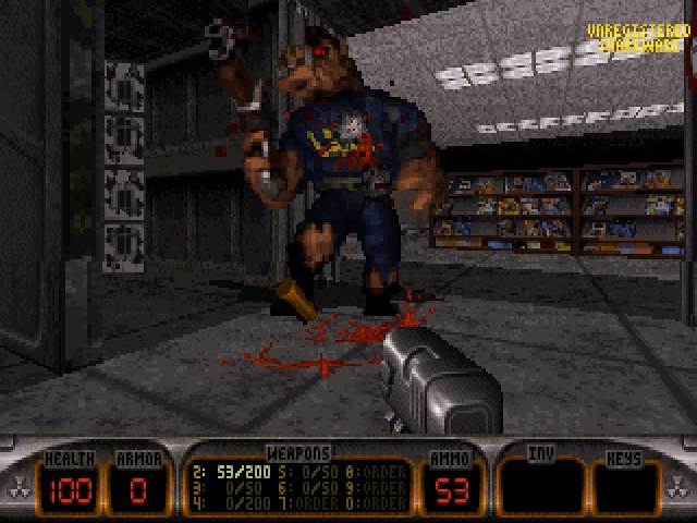 Duke Nukem 3D gameplay screenshot showing a Pig Cop enemy